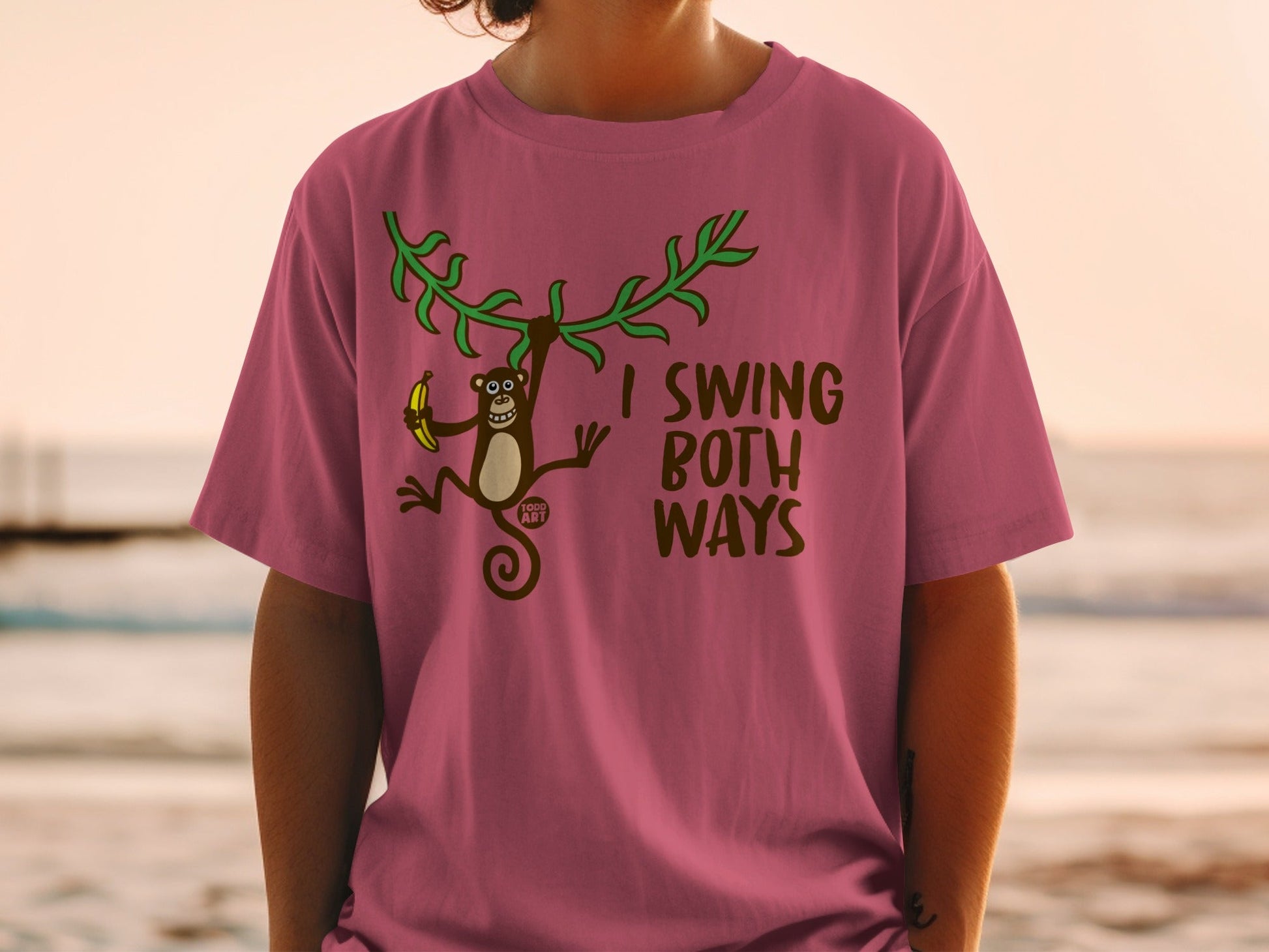 T-shirt with a monkey holding a banana and the text "I SWING BOTH WAYS".