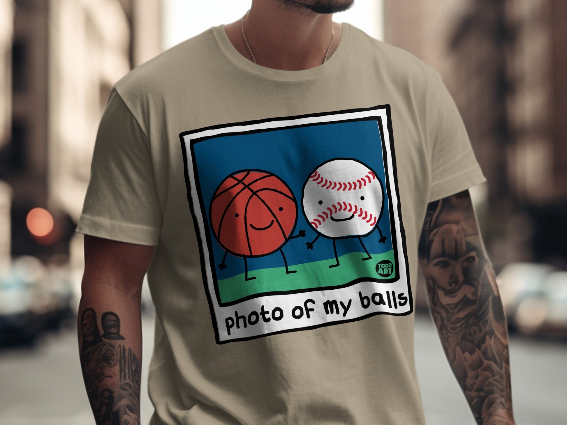 Cartoon basketball and baseball smiling together with "photo of my balls" text.