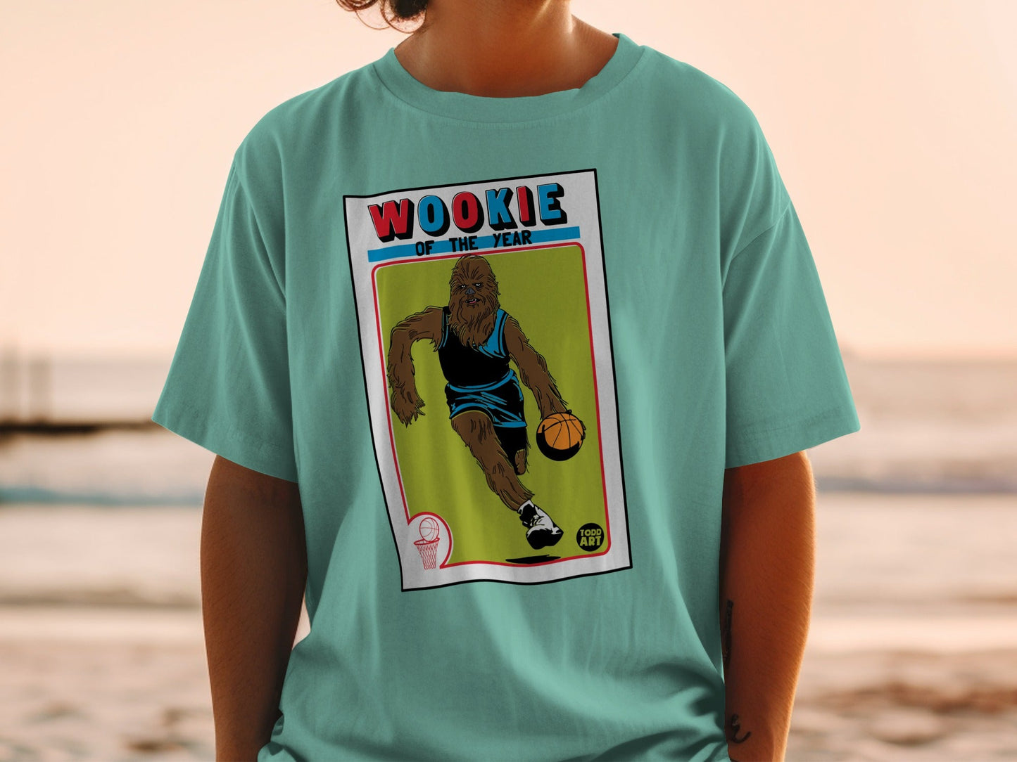 Wookiee of the Year basketball trading card graphic on teal t-shirt.