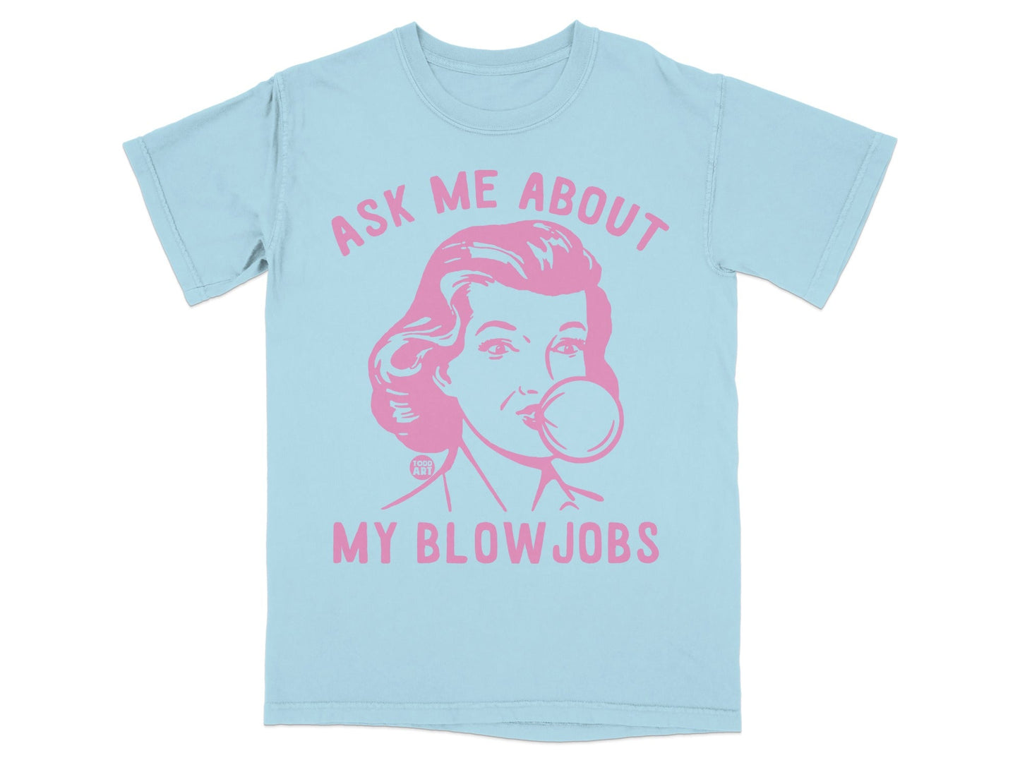 Light blue t-shirt with a pink graphic of a woman blowing bubblegum and text.