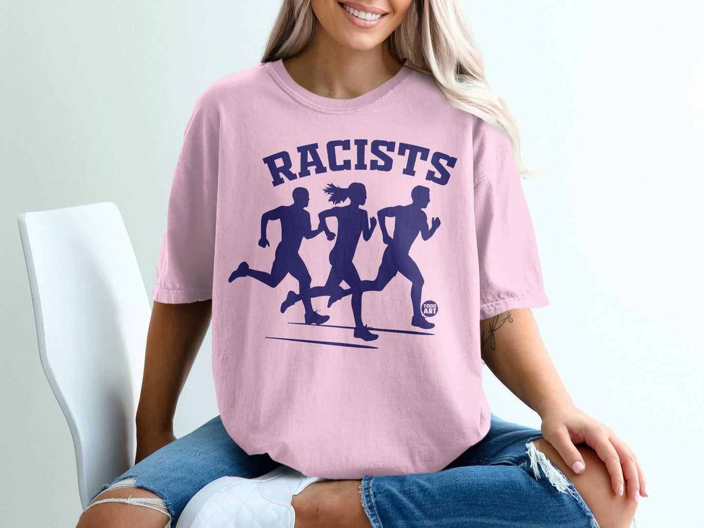 Pink t-shirt with "RACISTS" and three running silhouettes.