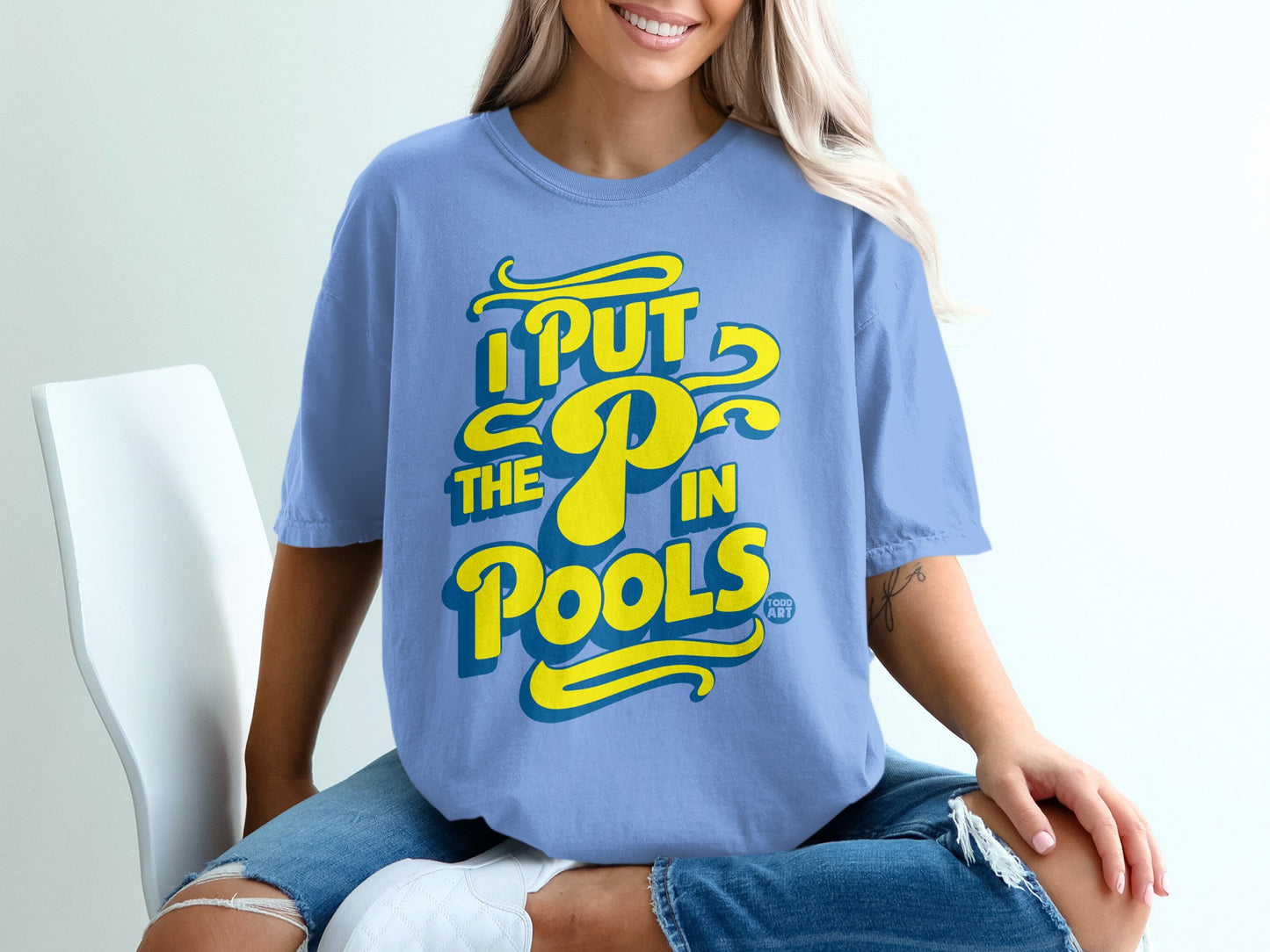 Blue t-shirt with yellow text "I PUT THE P IN POOLS"