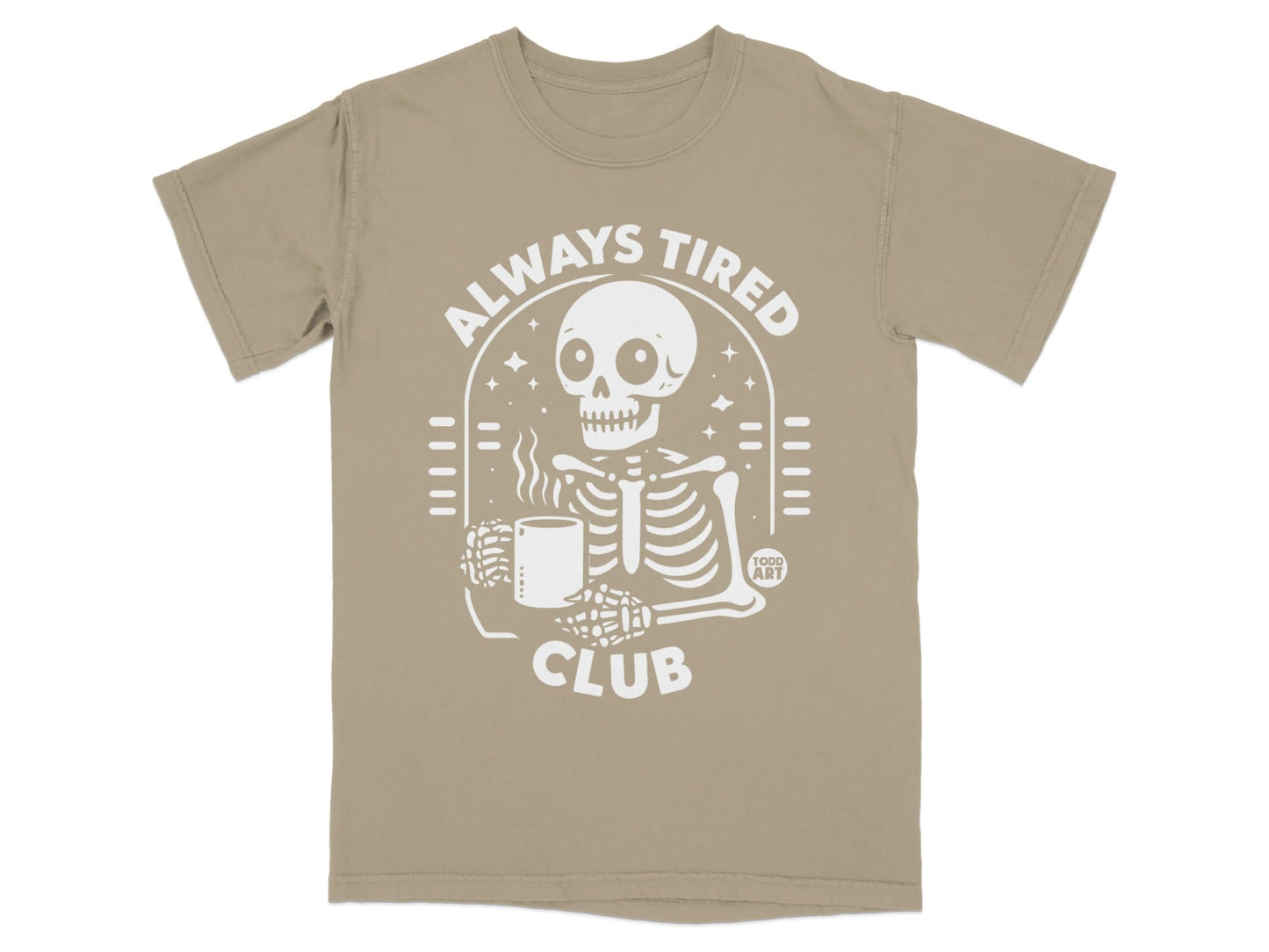 Skeleton in "ALWAYS TIRED CLUB" t-shirt holding a mug.
