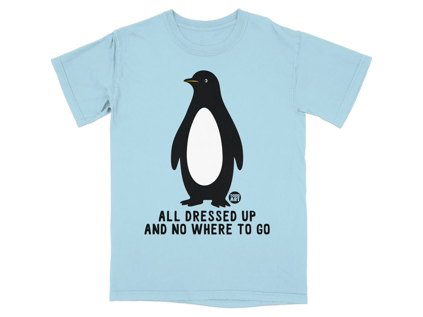 Light blue t-shirt with a penguin graphic and "ALL DRESSED UP AND NO WHERE TO GO".