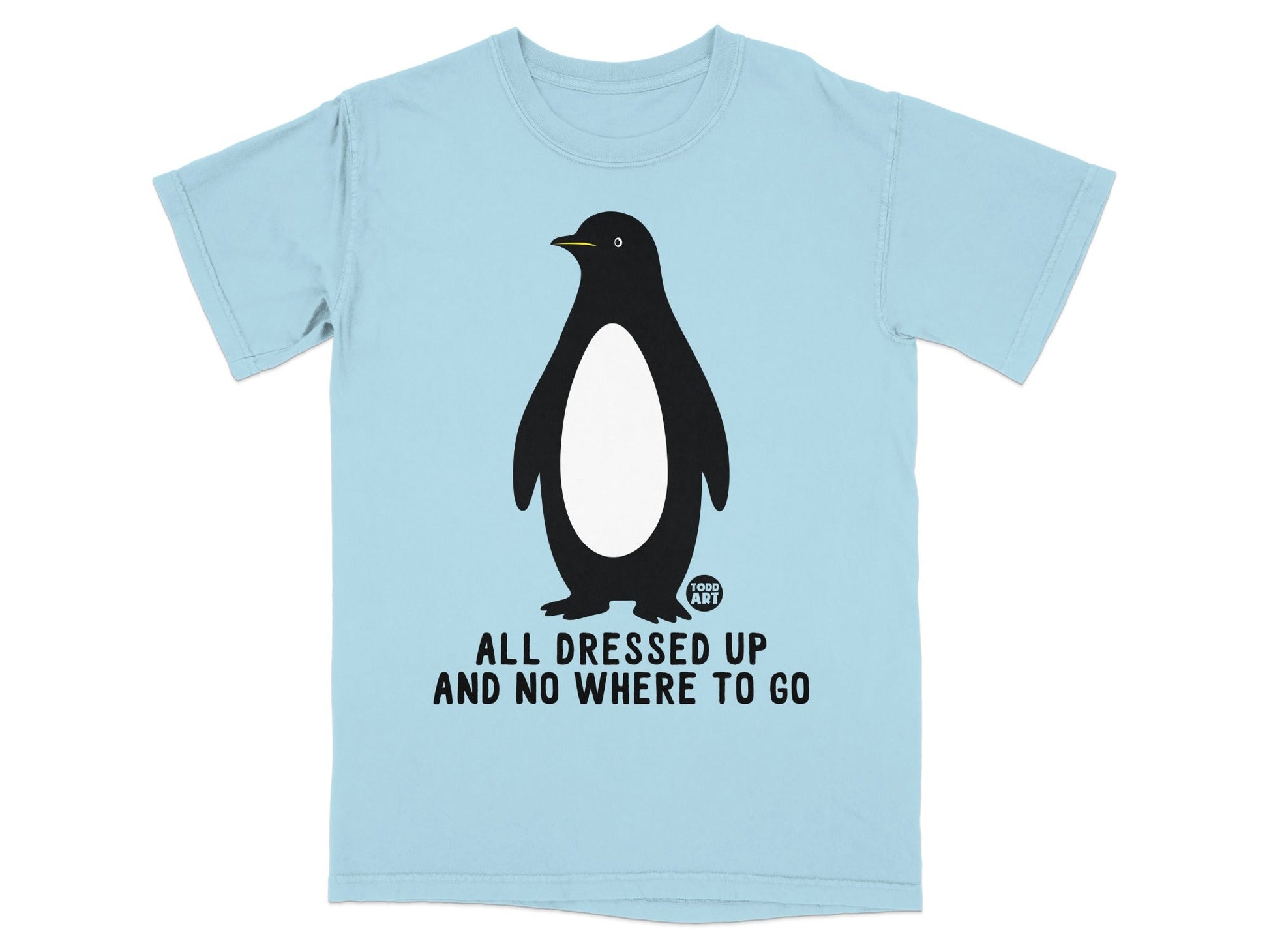 Light blue t-shirt with a penguin graphic and "ALL DRESSED UP AND NO WHERE TO GO".