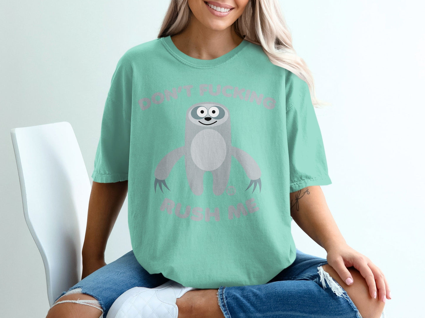 Mint t-shirt with a sloth graphic and text "DON'T FUCKING RUSH ME".