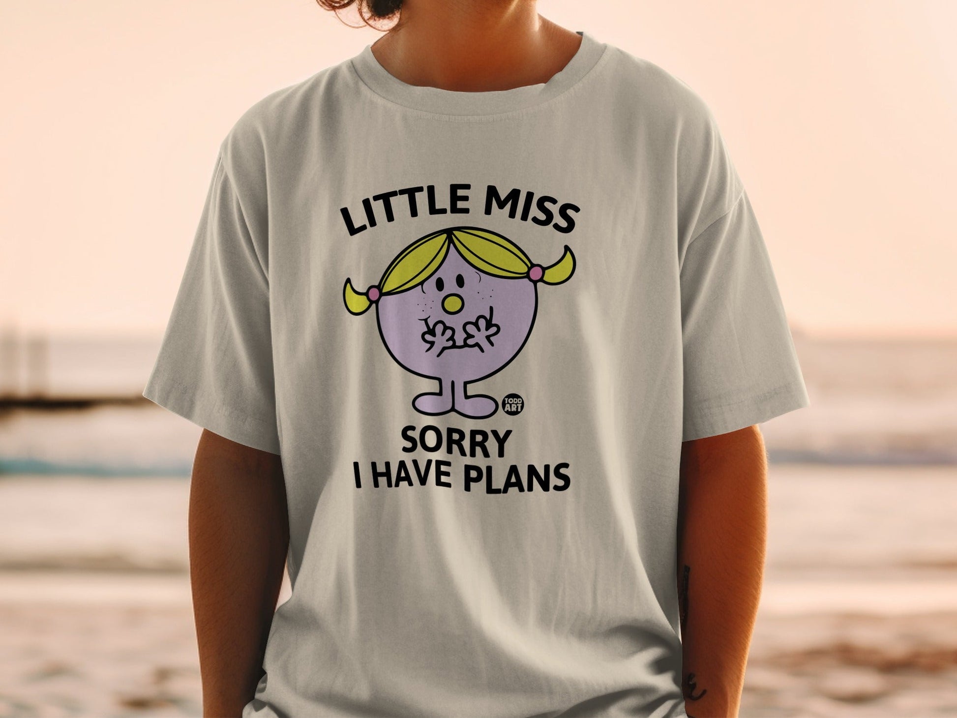Little Miss character on a t-shirt saying "Sorry I Have Plans."