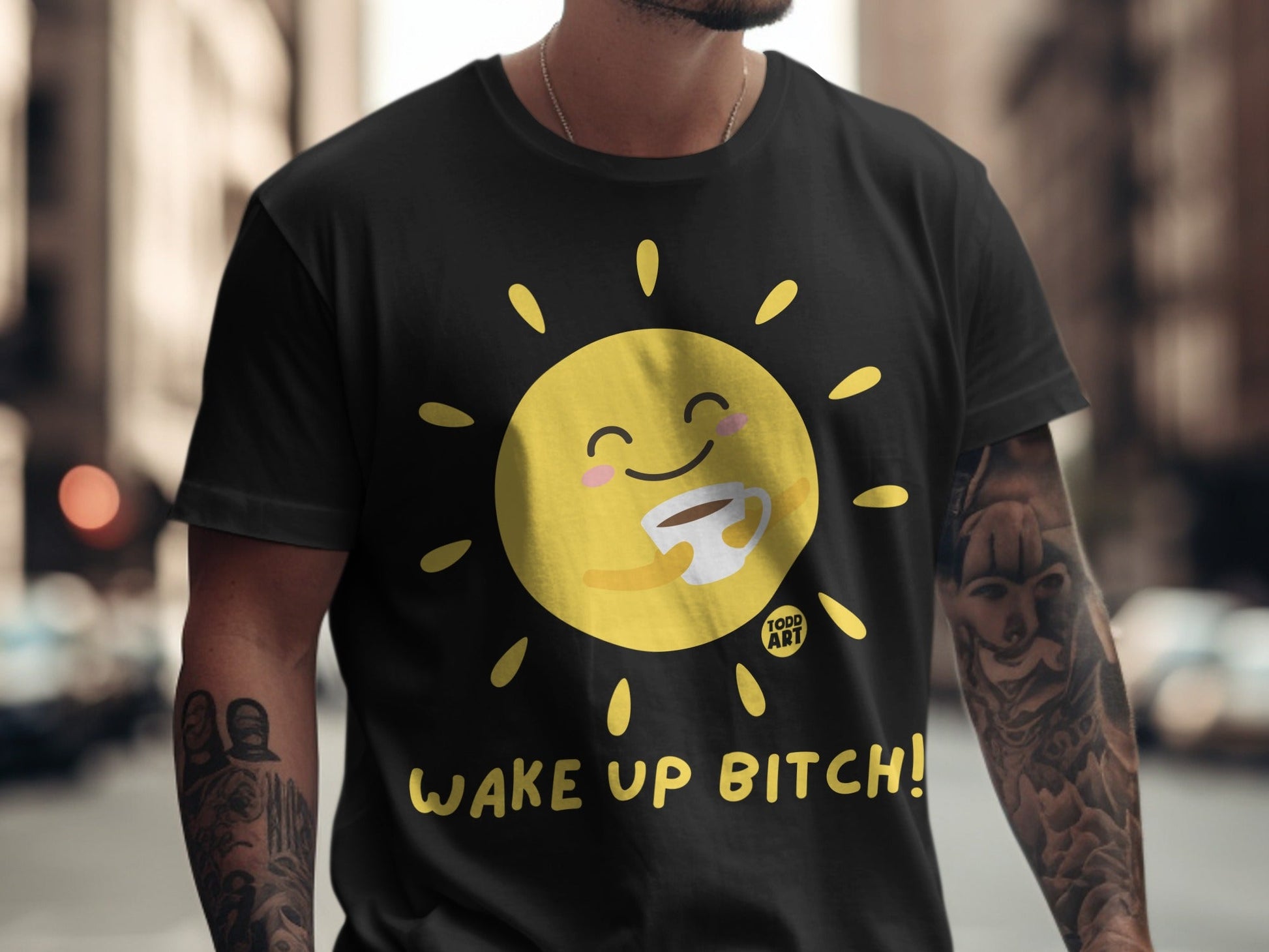 Black t-shirt with a smiling sun holding a coffee mug, text "Wake Up Bitch!".