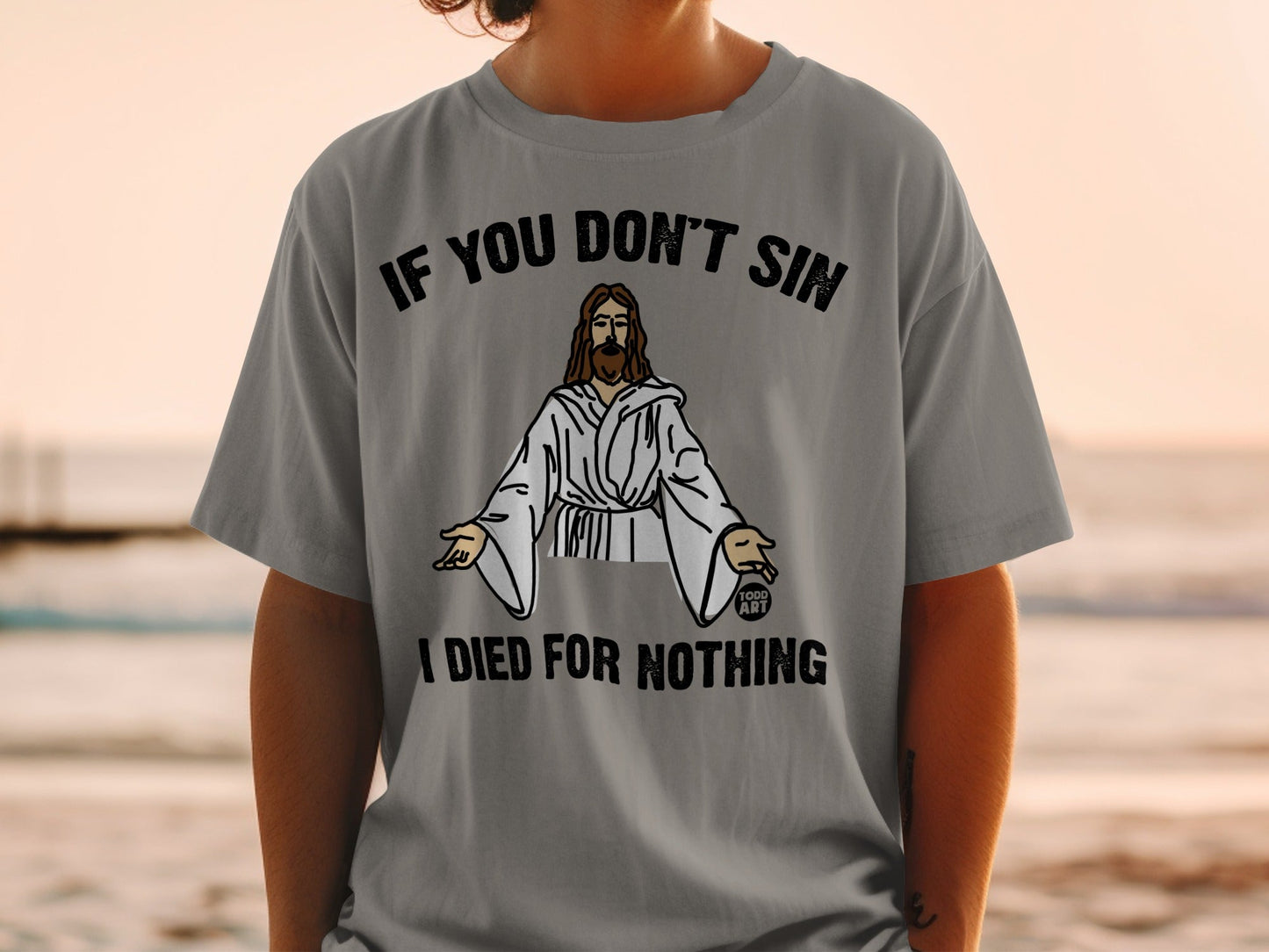 Grey t-shirt with graphic of Jesus and text "IF YOU DON'T SIN I DIED FOR NOTHING".