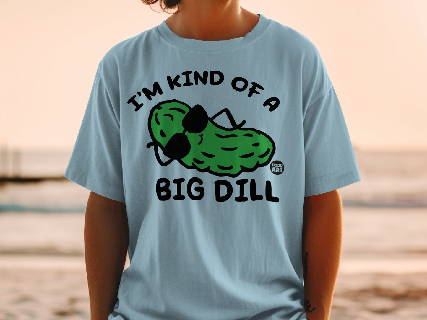 T-shirt with "I'm kind of a big dill" text and cartoon pickle wearing sunglasses.