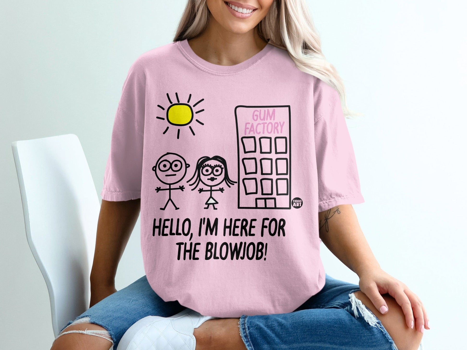Pink t-shirt with "GUM FACTORY" and stick figures on it.