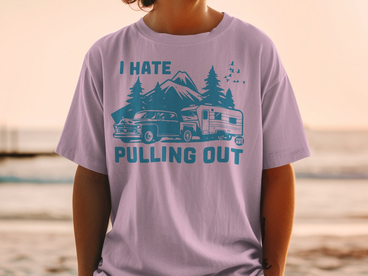 T-shirt with blue graphic of vintage car and camper, mountains, and "I Hate Pulling Out" text.