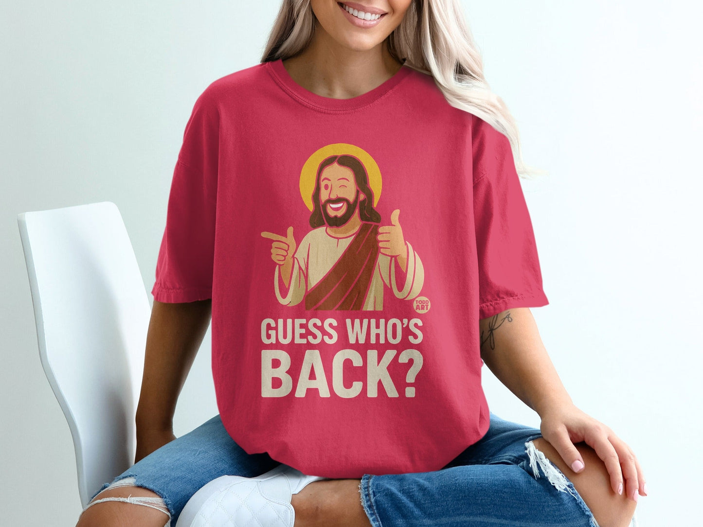 Red t-shirt with "GUESS WHO'S BACK?" and Jesus graphic.
