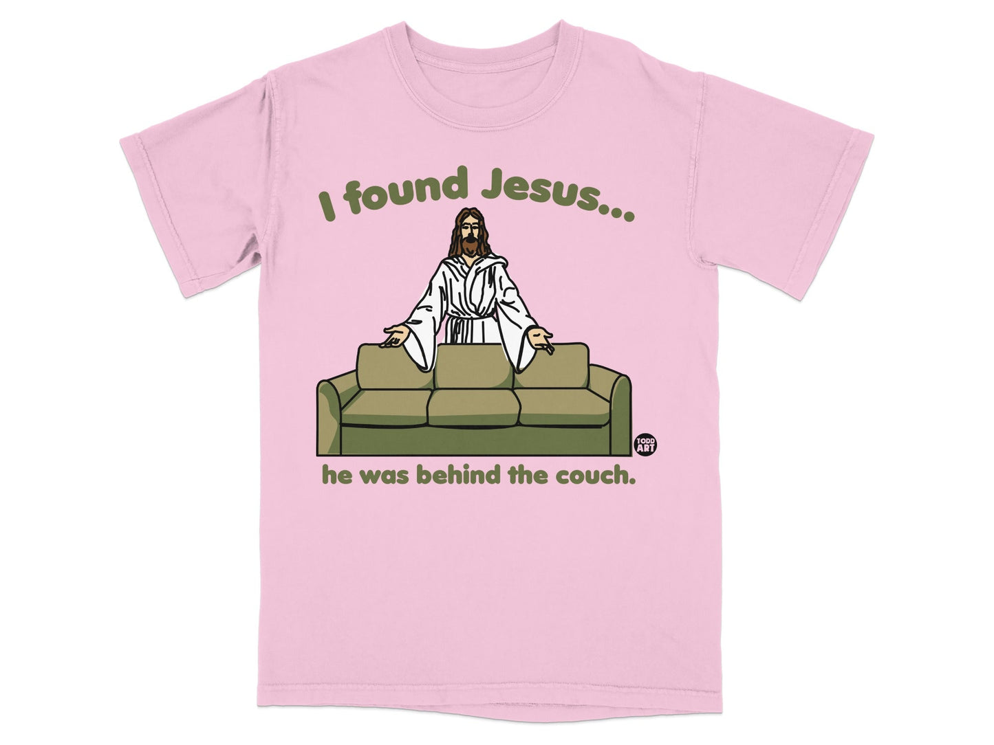 Pink t-shirt with "I found Jesus... he was behind the couch" text and cartoon Jesus.