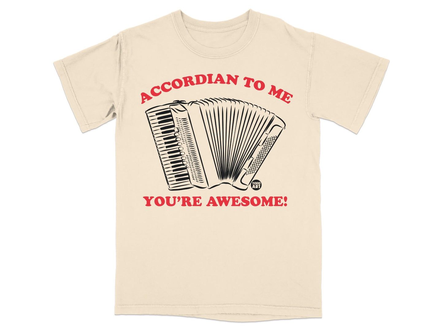 Beige t-shirt with accordion illustration and text "ACCORDIAN TO ME YOU'RE AWESOME!".