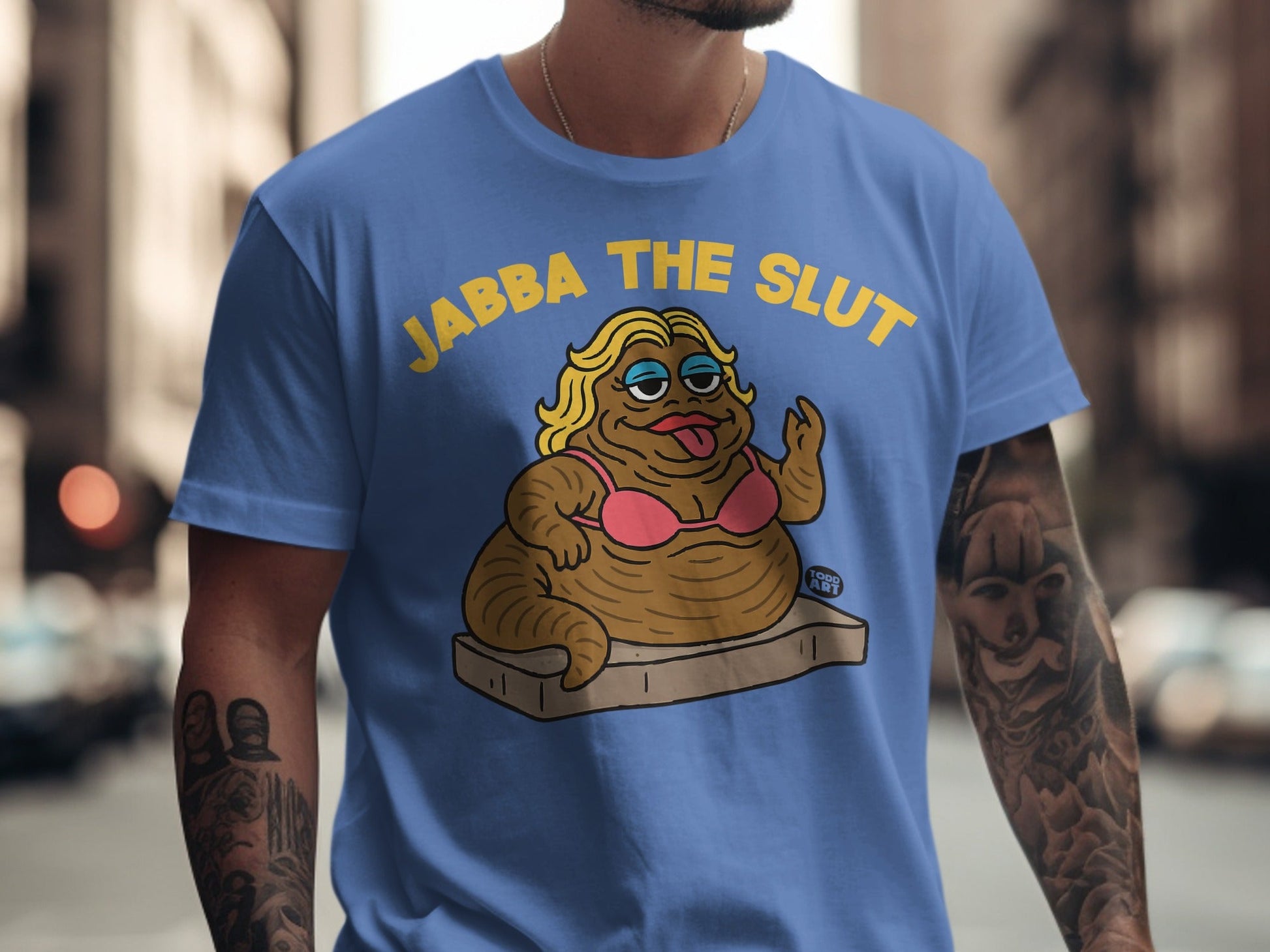 Jabba the Hutt character in pink bra and underwear on a brown mattress.