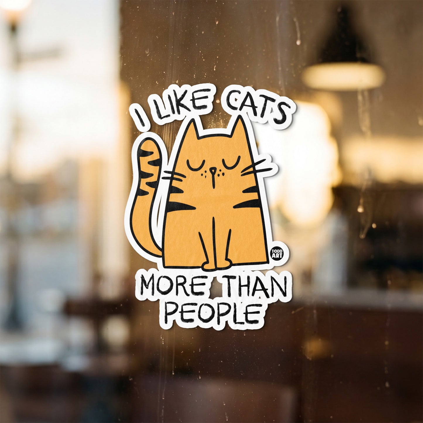 Sticker with text "I LIKE CATS MORE THAN PEOPLE" and a cartoon cat.