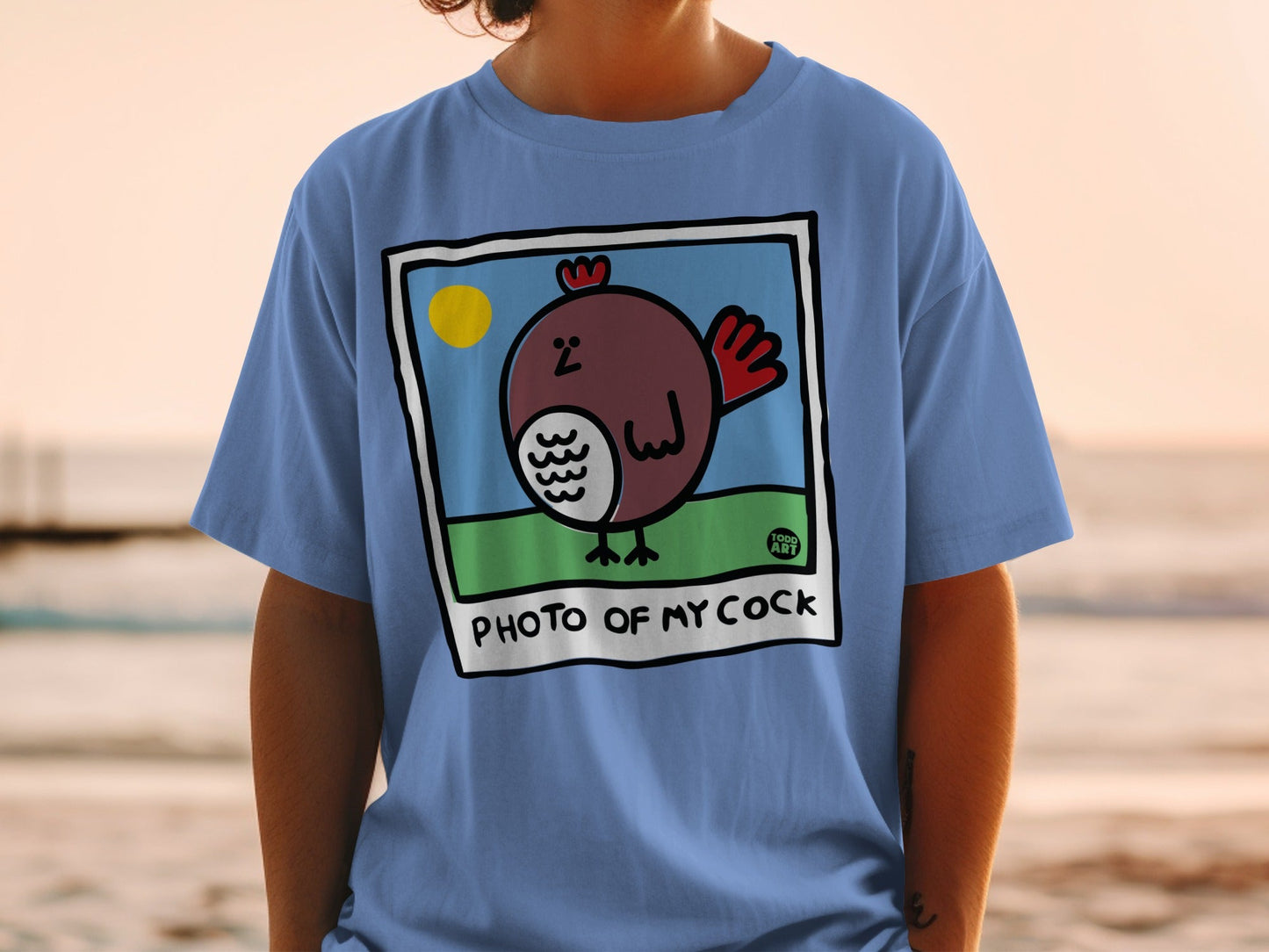 Blue t-shirt with cartoon chicken in a photo frame, "PHOTO OF MY COCK" text.