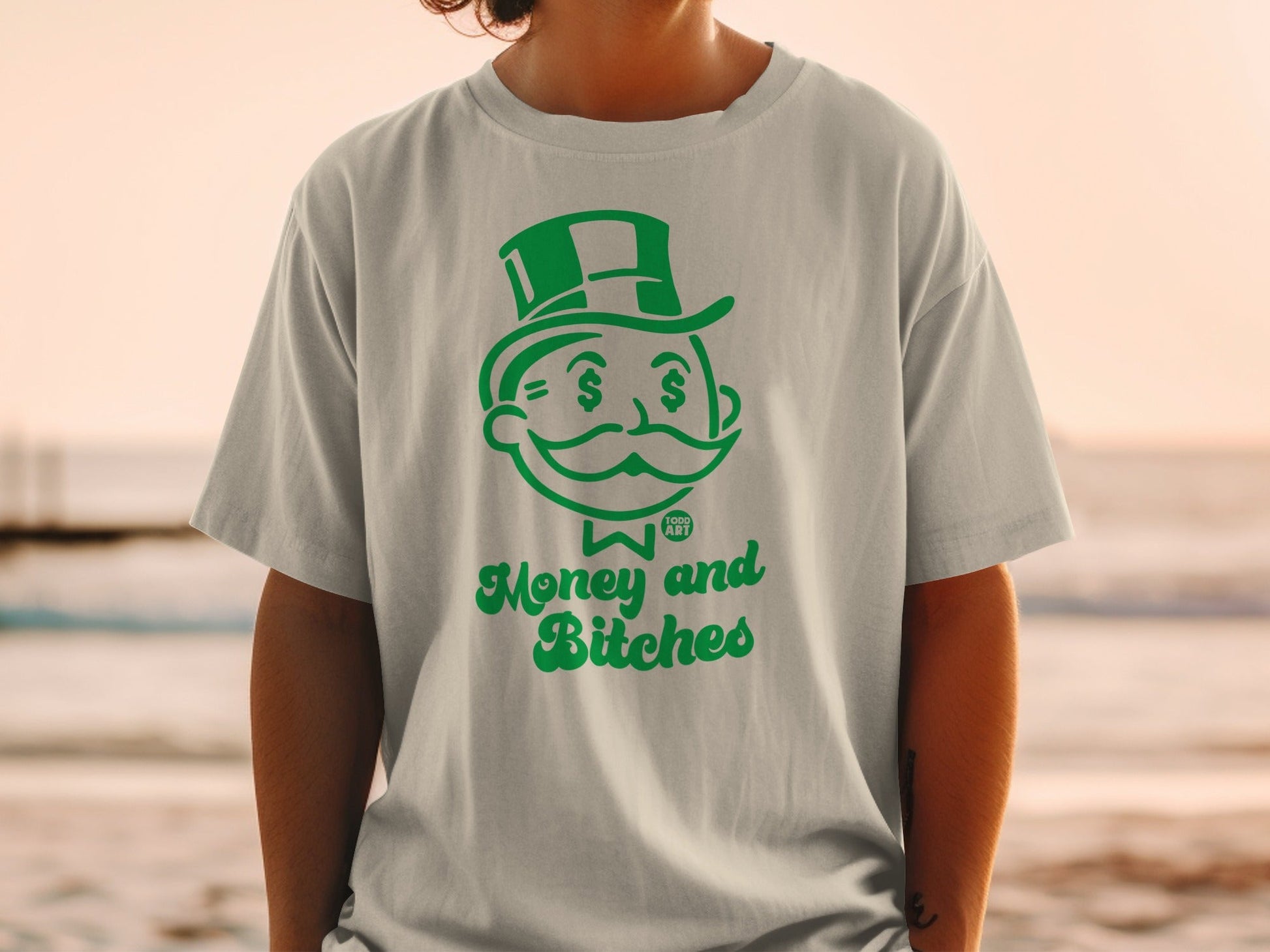 T-shirt with green cartoon Monopoly Man and "Money and Bitches" text.