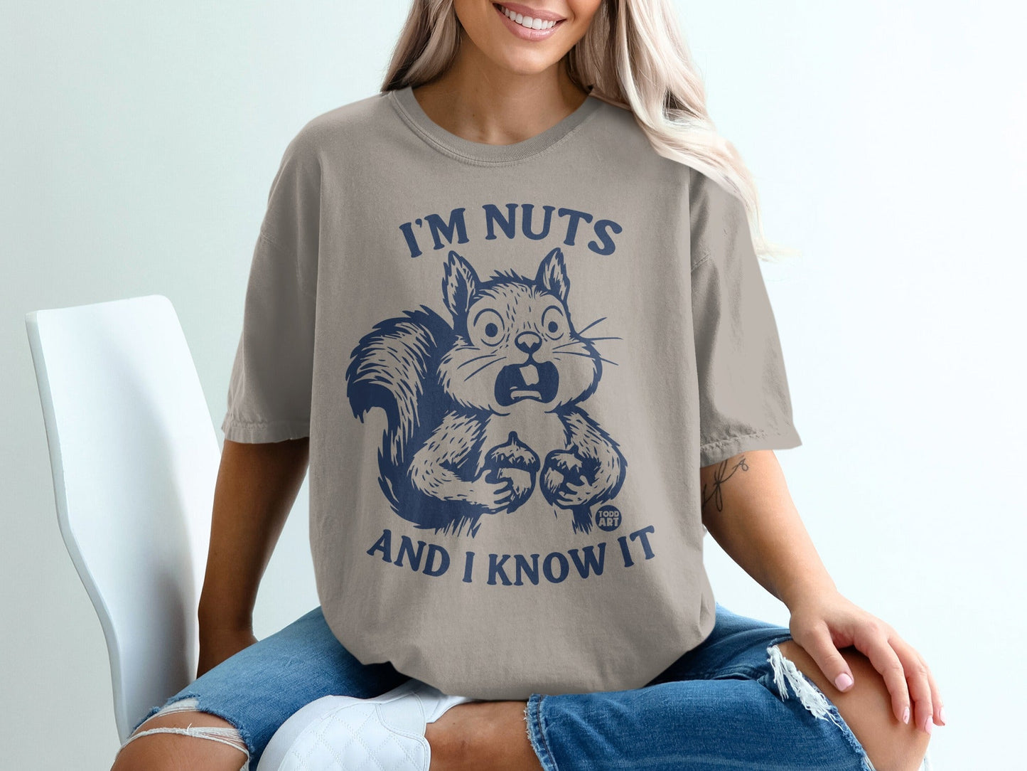 T-shirt with a surprised squirrel design and text "I'M NUTS AND I KNOW IT".