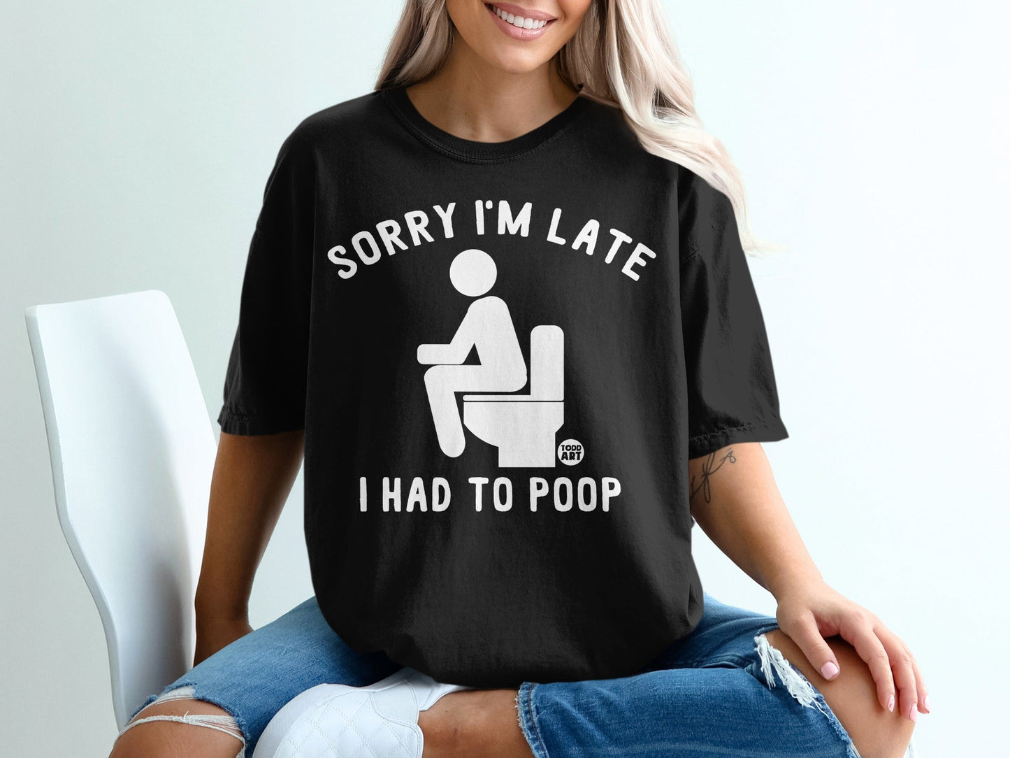 Black t-shirt with white text: "SORRY I'M LATE I HAD TO POOP" and toilet graphic.