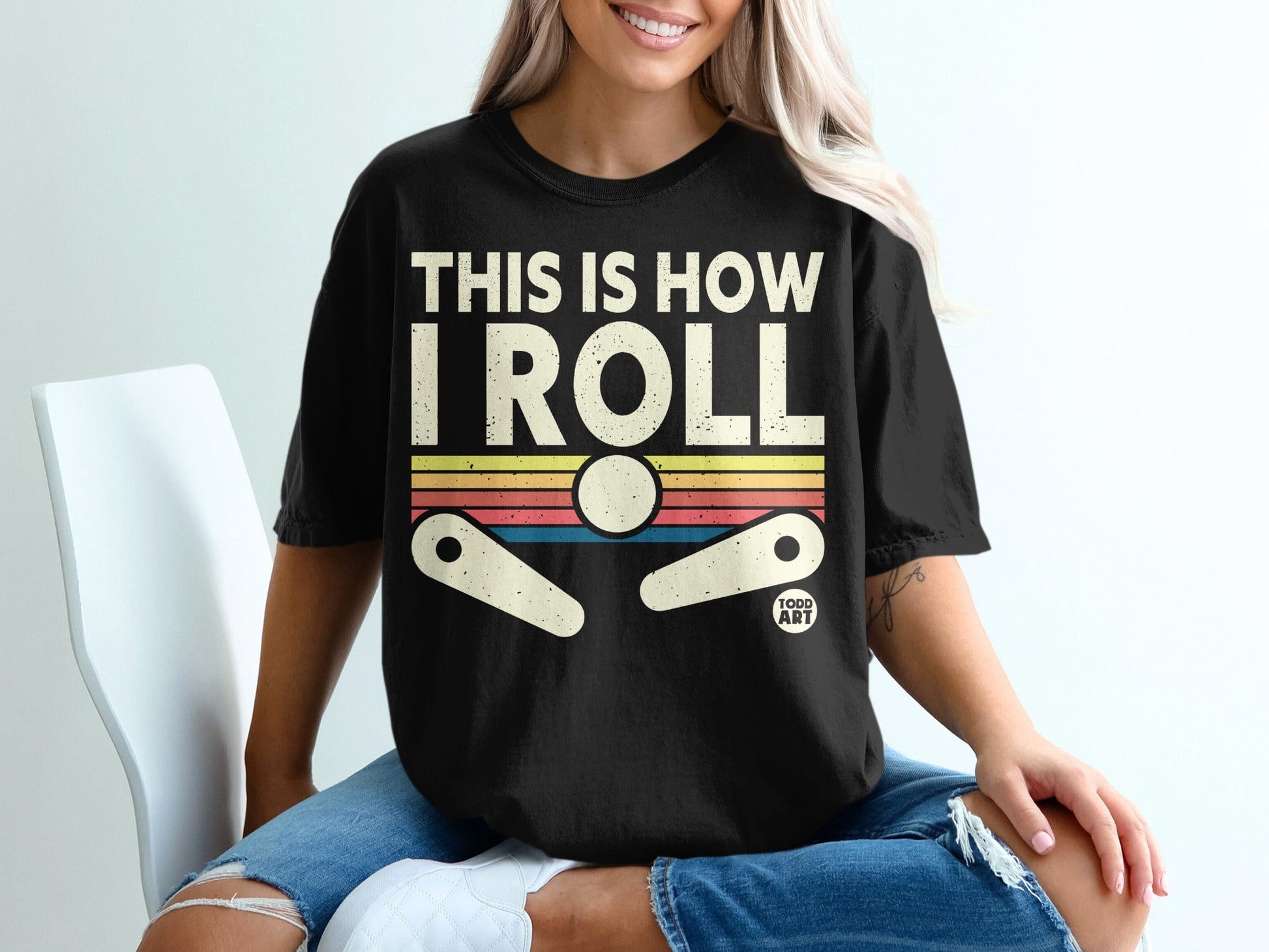 Black t-shirt with "THIS IS HOW I ROLL" and pinball design.