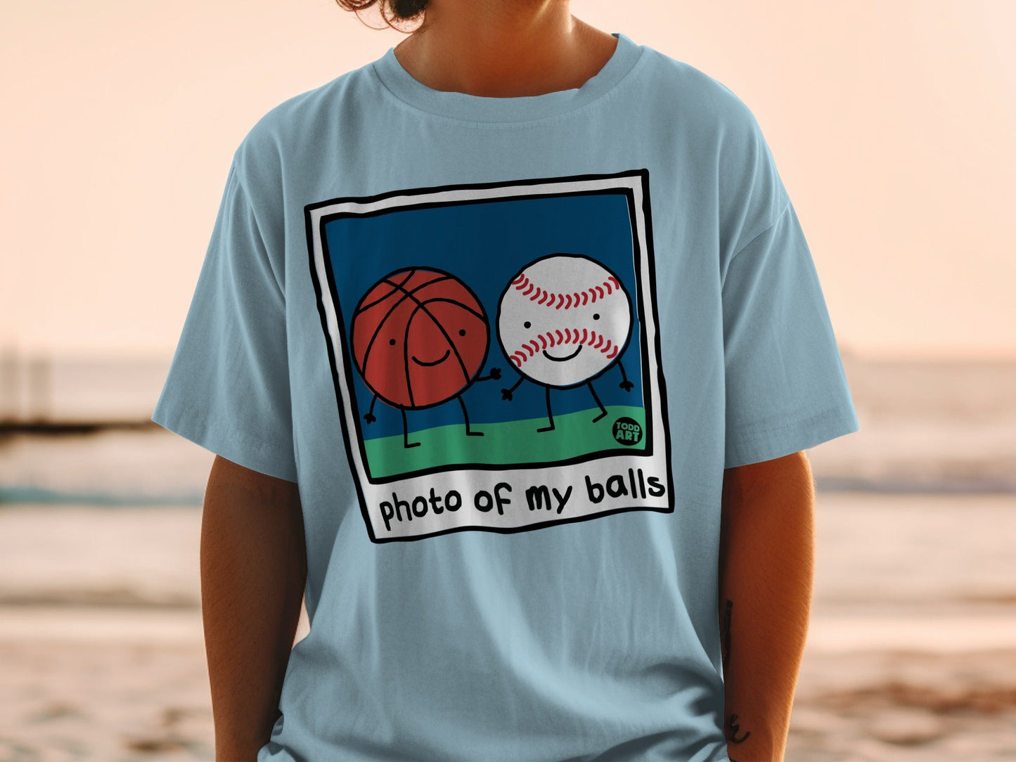 Cartoon basketball and baseball characters holding hands with text "photo of my balls".