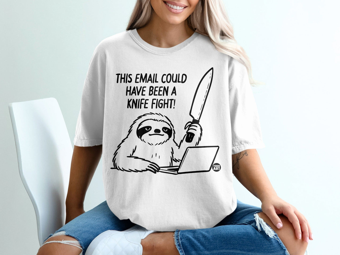 T-shirt graphic of a sloth at a laptop holding a knife, with text "This email could have been a knife fight!".