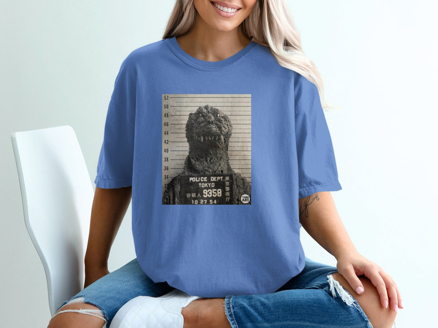 Godzilla mugshot shirt with "POLICE DEPT TOKYO" text.
