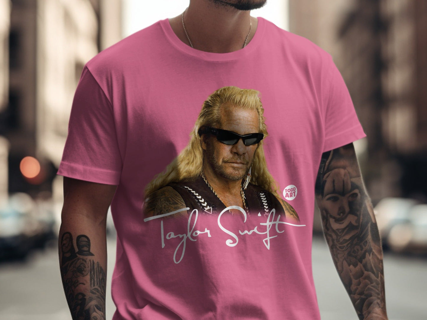 Pink t-shirt with Dog the Bounty Hunter graphic and "Taylor Swift" text.