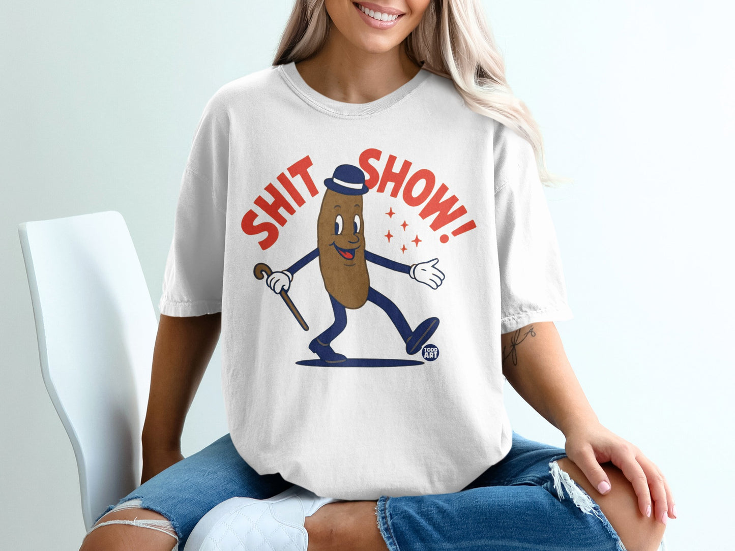 Cartoon character in a hat and cane with text "SHIT SHOW!"