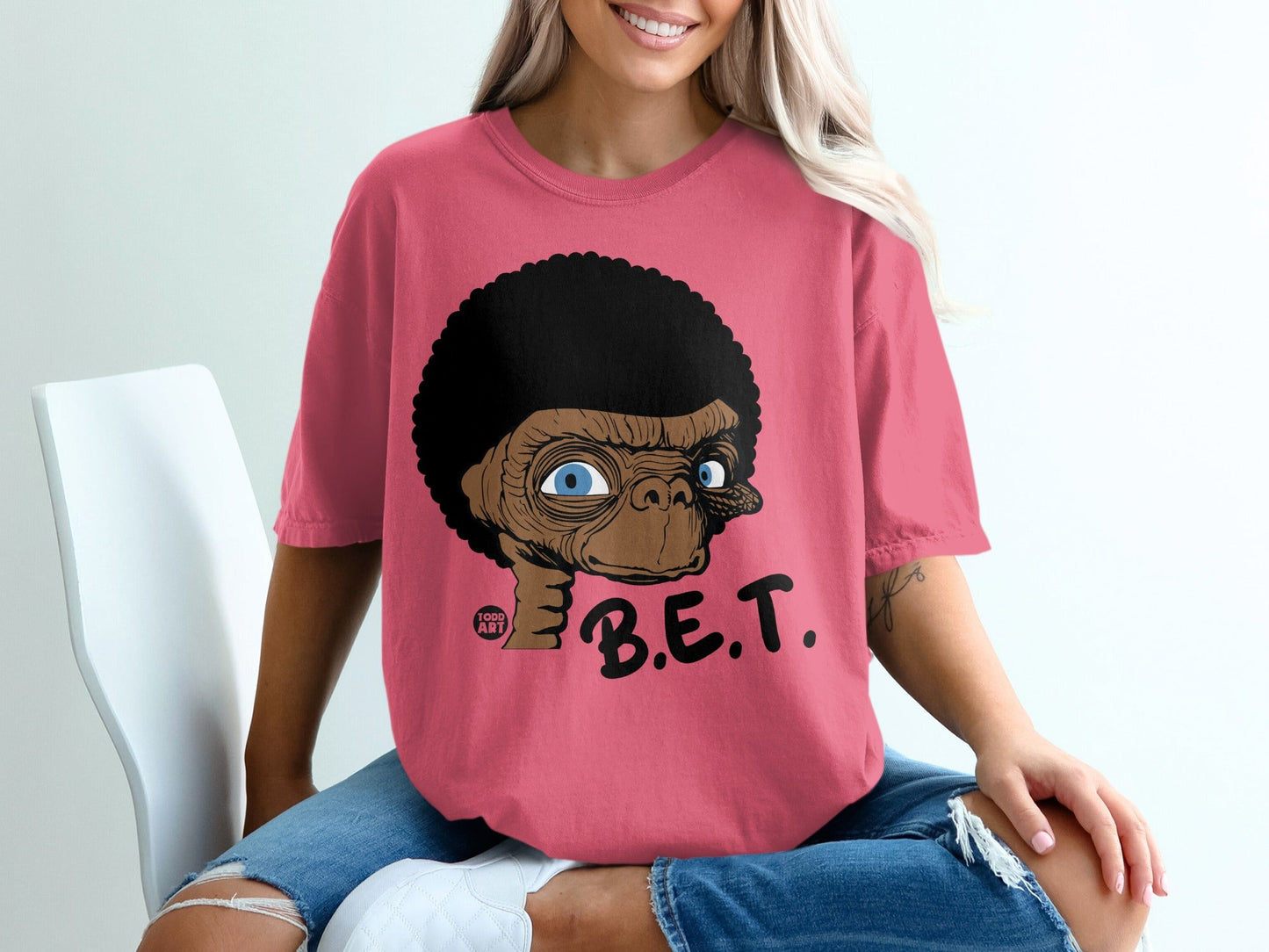 Pink t-shirt with E.T. character design and "B.E.T." text.