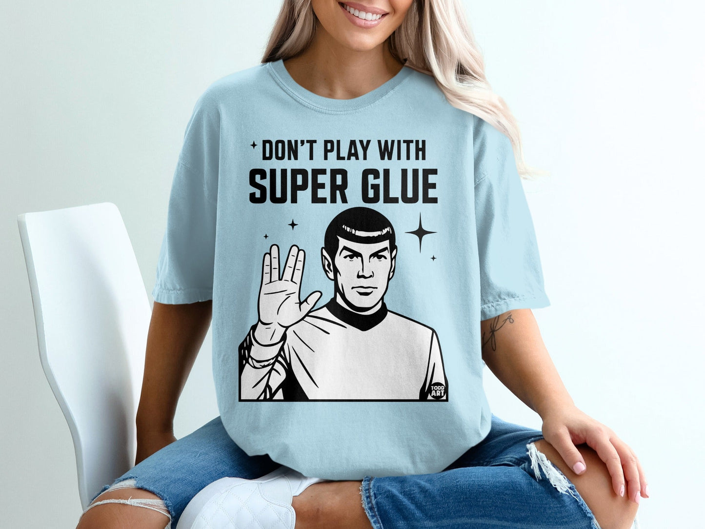 Light blue t-shirt with Spock from Star Trek and text "Don't Play With Super Glue".