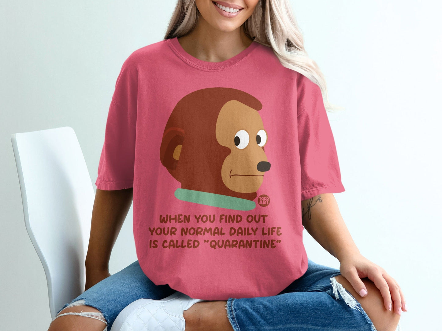 Pink t-shirt with monkey meme and text about quarantine.