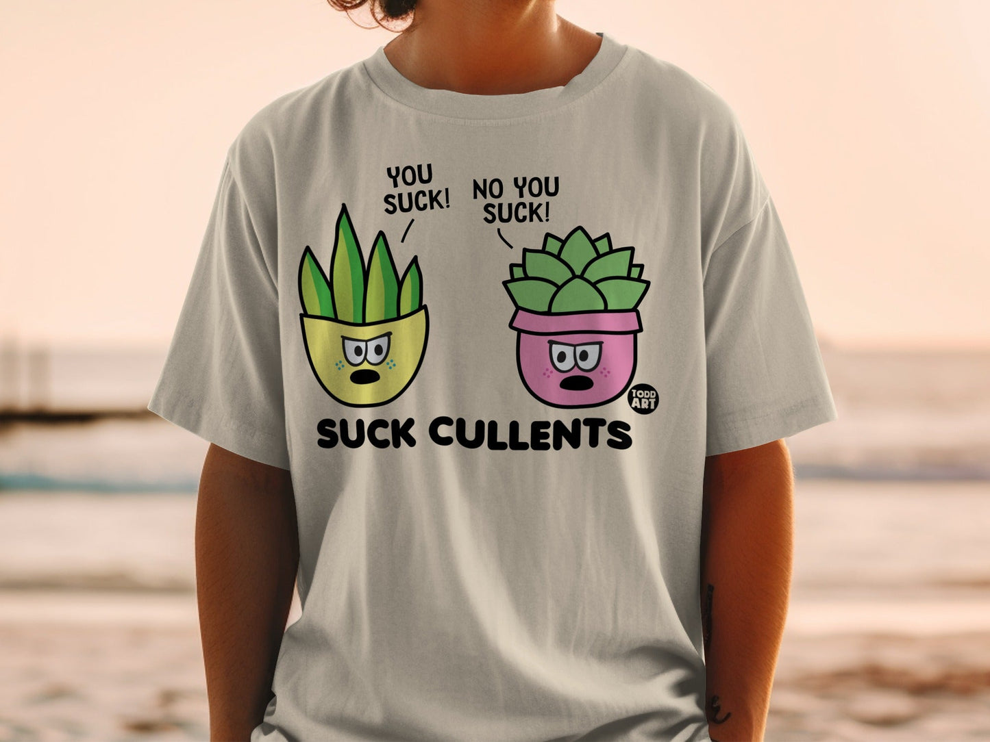T-shirt graphic of two potted succulents saying "You suck!" and "No you suck!".