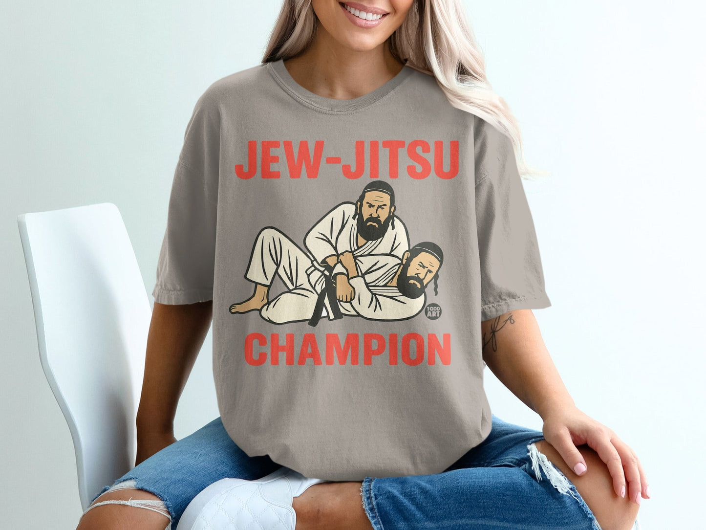 T-shirt with "JEW-JITSU CHAMPION" text and graphic of two men in martial arts gear.