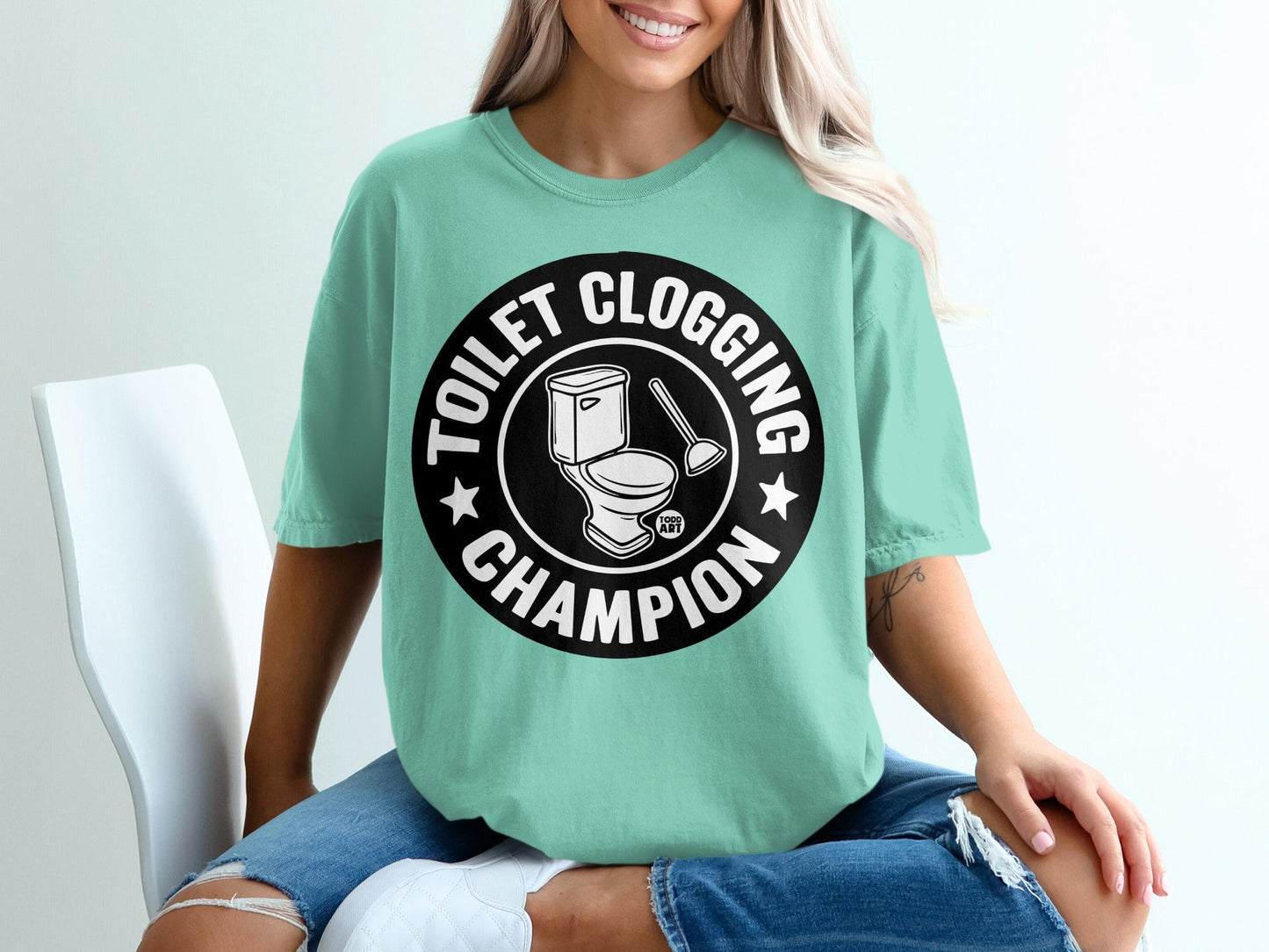 Circle graphic with toilet, plunger, and "Toilet Clogging Champion" text.