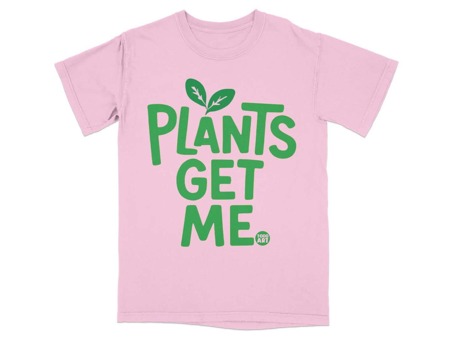Pink t-shirt with green "PLANTS GET ME" text and a small "TODD ART" logo.
