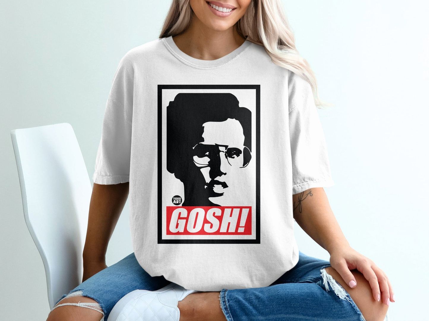 White t-shirt with black graphic of a man's face and the word "GOSH!".