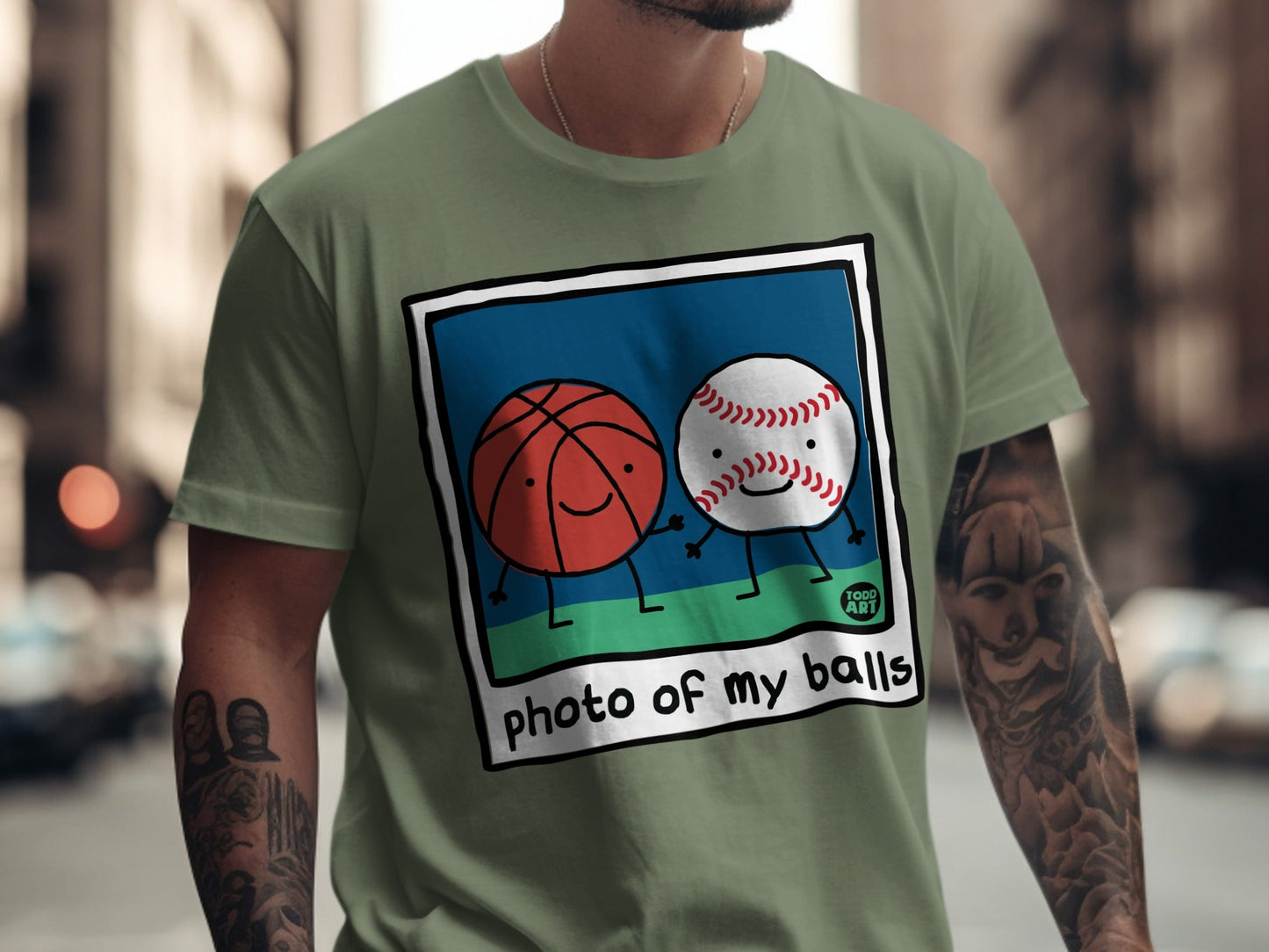 Basketball and baseball characters smiling in a photo frame with "photo of my balls" text.