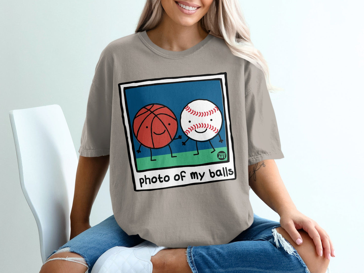 Basketball and baseball characters holding hands with "photo of my balls" text.