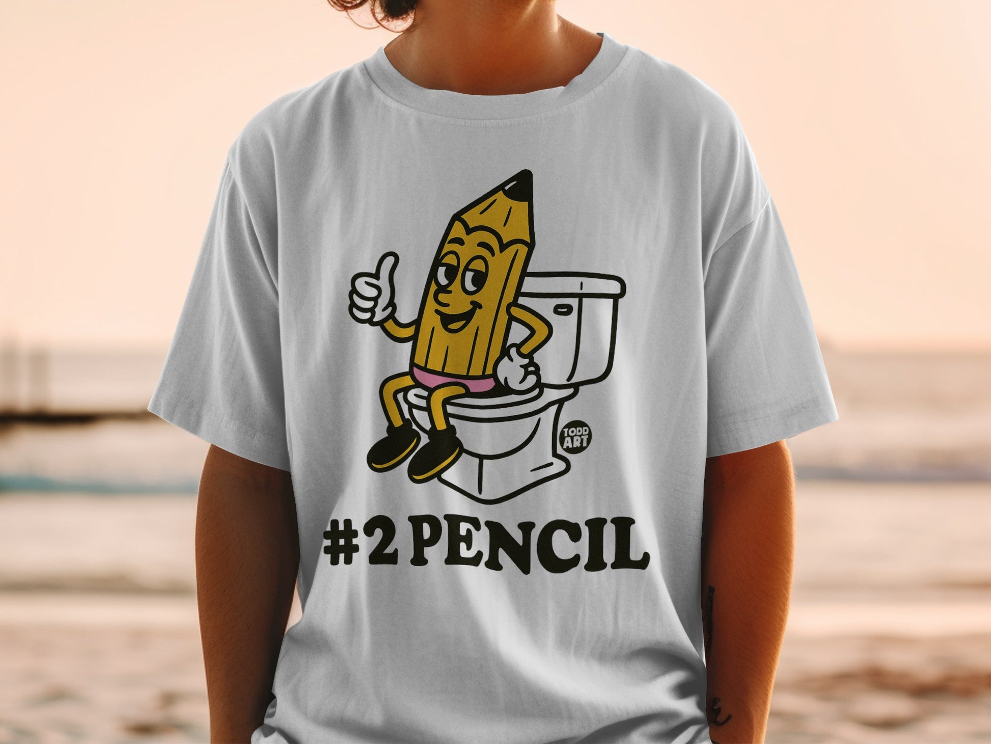 T-shirt with cartoon pencil giving a thumbs up on a toilet, "#2PENCIL" text.