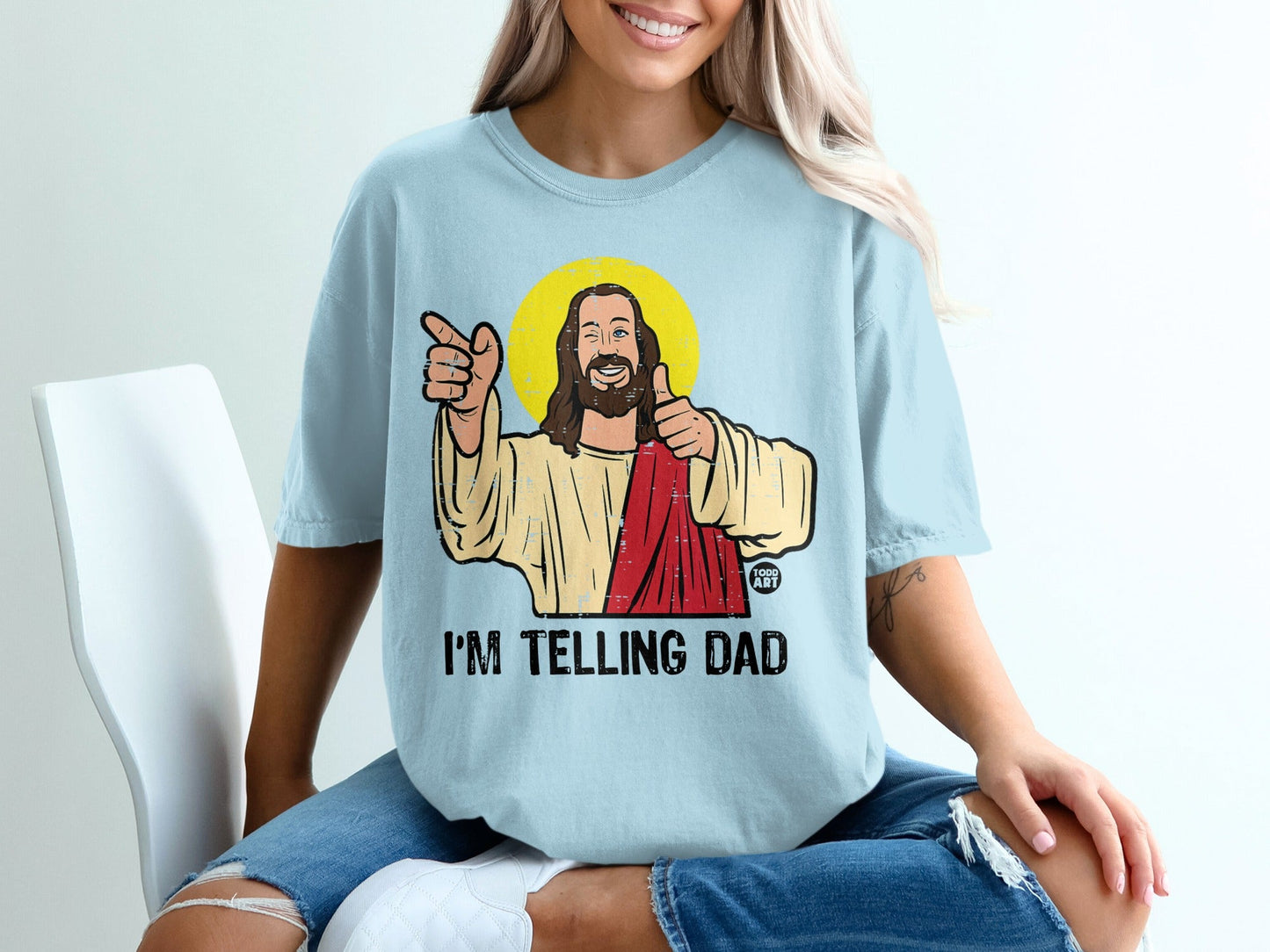 Jesus in a light blue shirt pointing and giving thumbs up with text "I'M TELLING DAD".