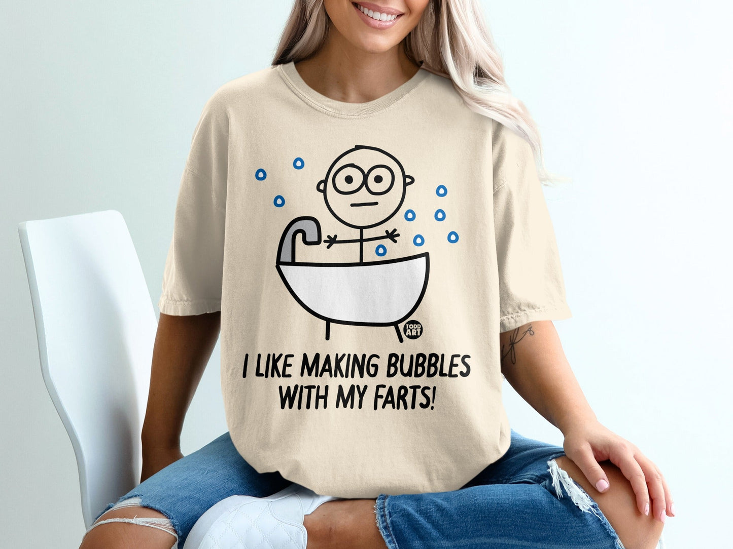 T-shirt with cartoon person in bathtub, surrounded by bubbles, reads "I like making bubbles with my farts!"