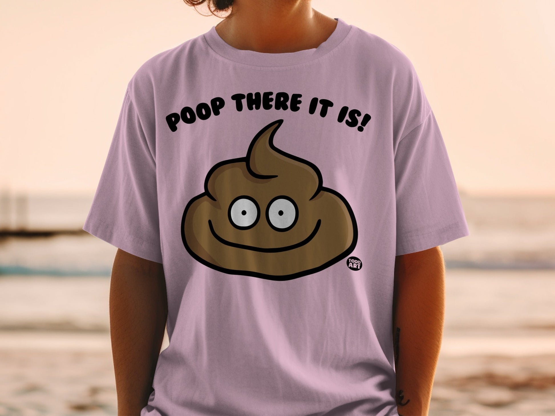 Purple t-shirt with smiling poop emoji and text "Poop there it is!"