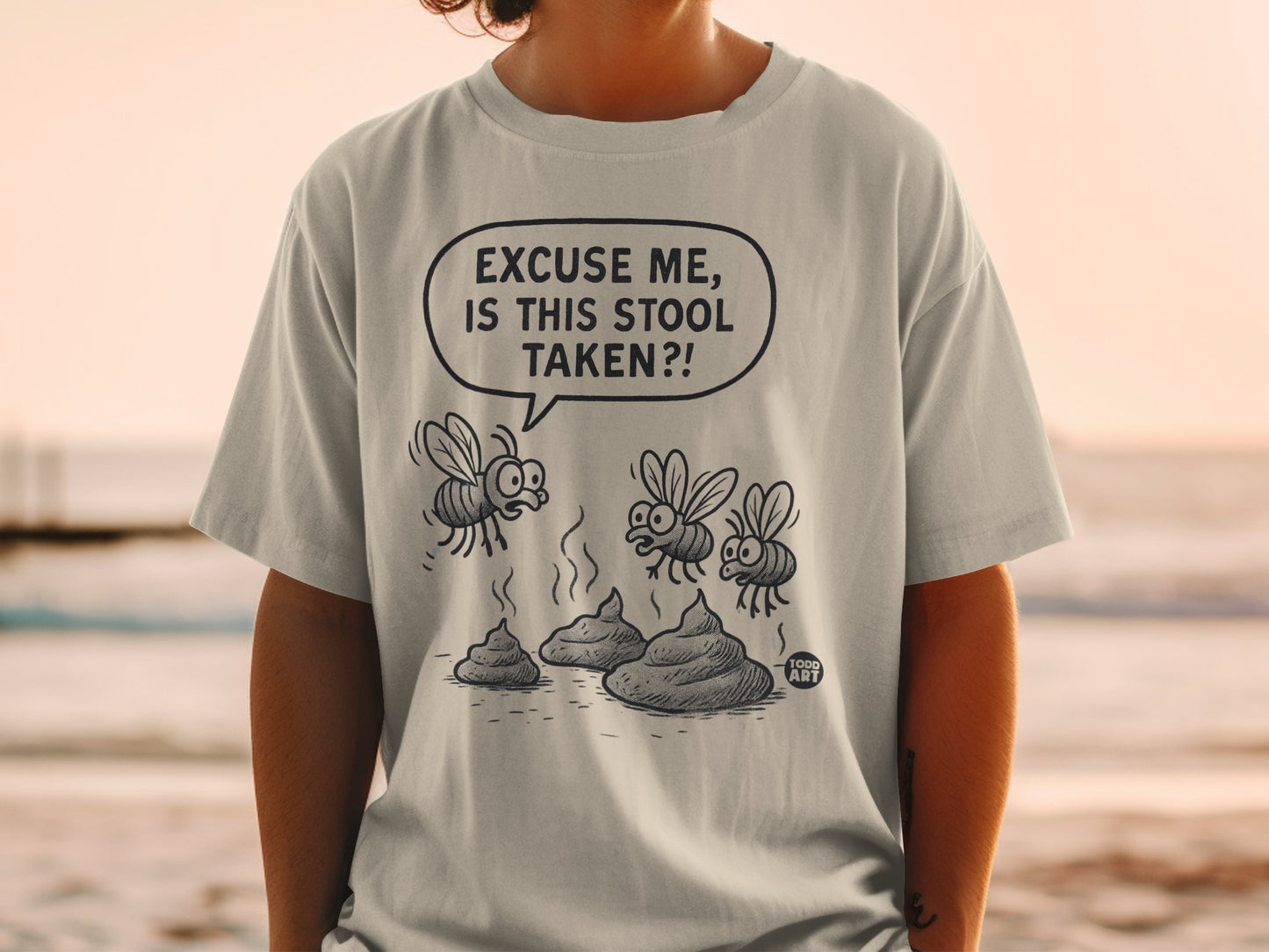 T-shirt with cartoon flies asking "Excuse me, is this stool taken?".