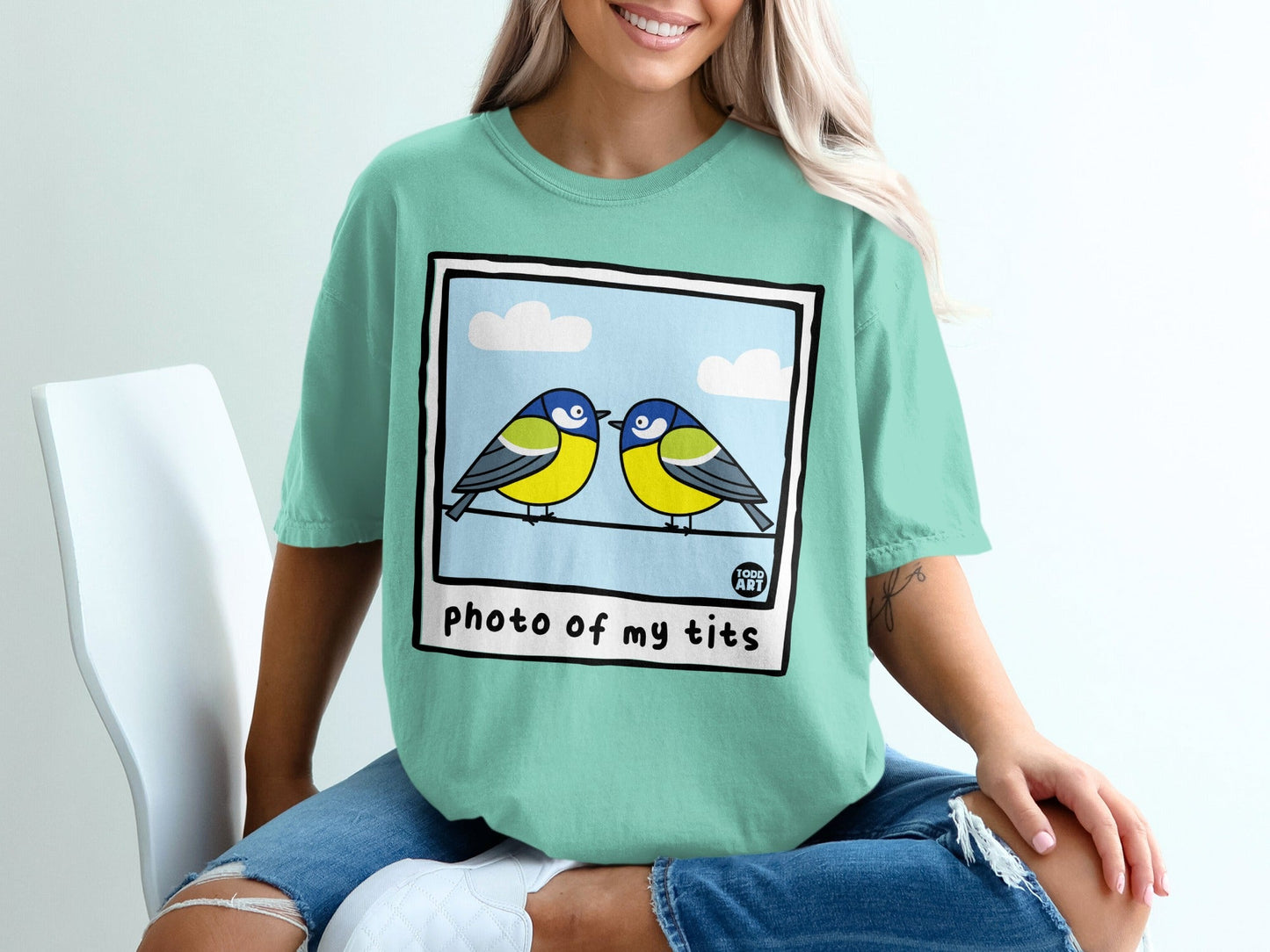 Two blue and yellow birds perched on a wire, text reads "photo of my tits".