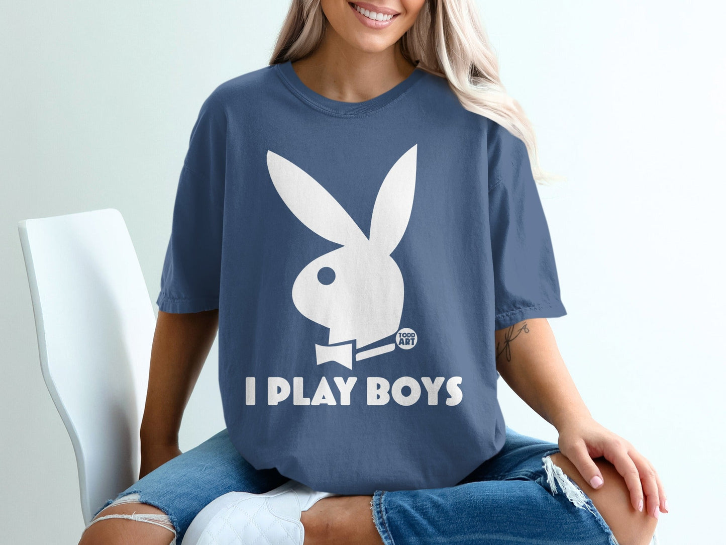 Blue t-shirt with white Playboy bunny logo and "I PLAY BOYS" text.