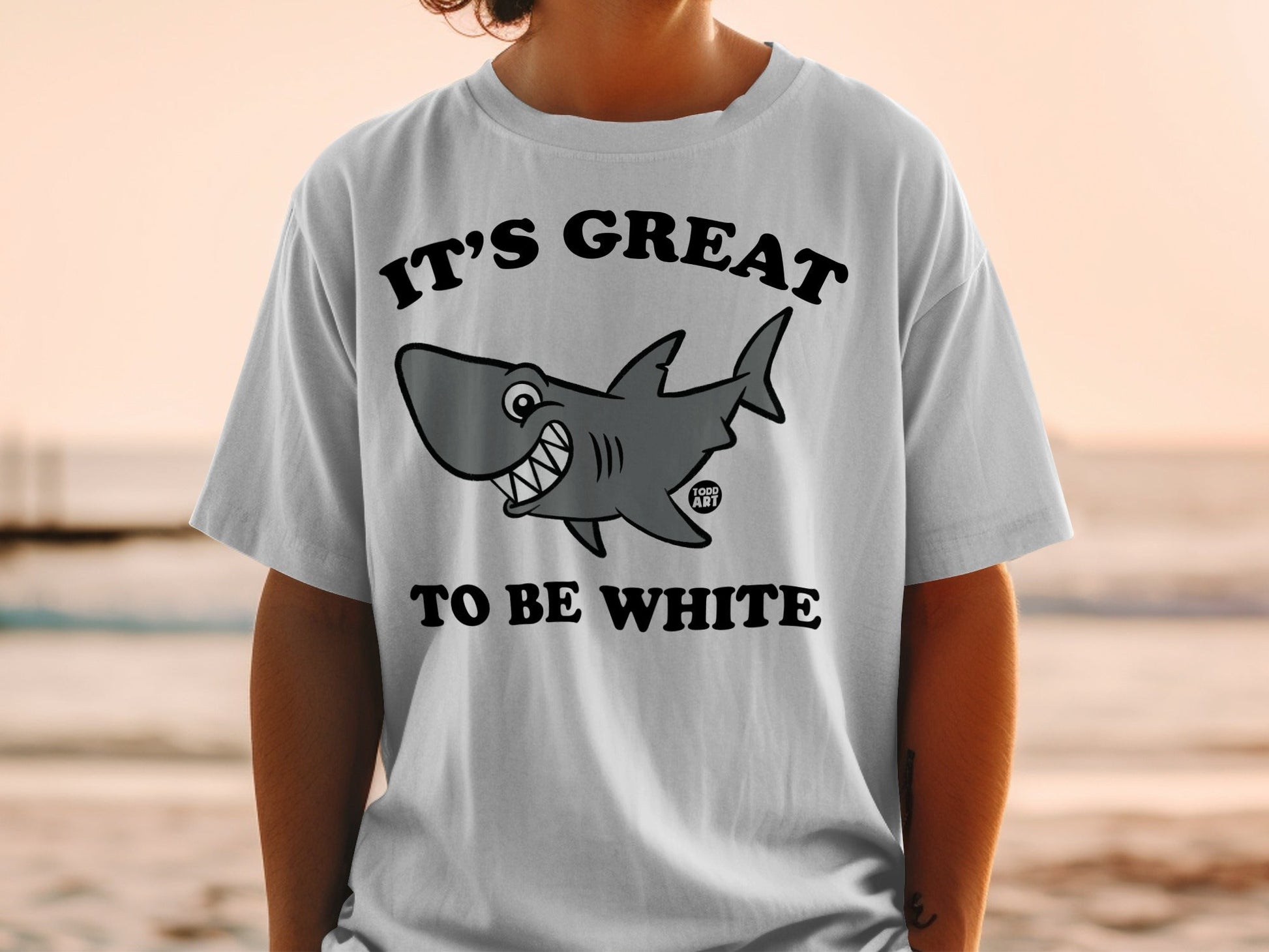 White t-shirt with shark graphic and text "IT'S GREAT TO BE WHITE."