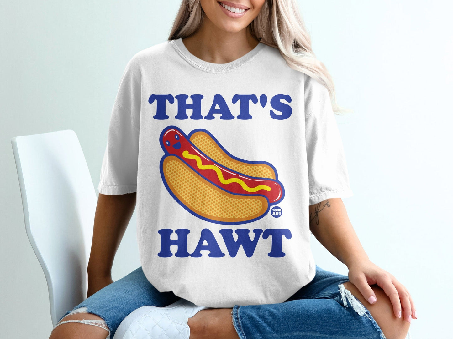 T-shirt with cartoon hot dog and text "THAT'S HAWT".
